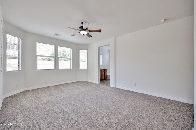 9072 W Myrtle Ave, Glendale, AZ 85305 - unfurnished room featuring ceiling fan, light carpet, and baseboards