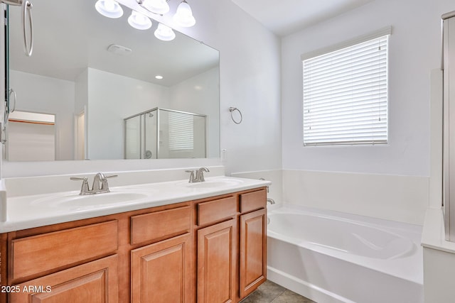 9072 W Myrtle Ave, Glendale, AZ 85305 - bathroom featuring a bath, a stall shower, double vanity, and tile patterned floors