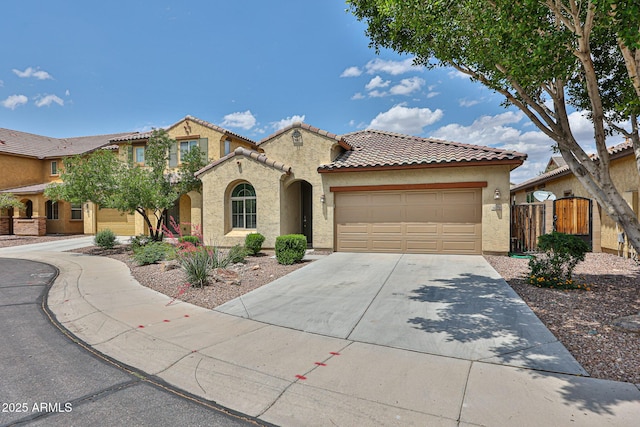 9072 W Myrtle Ave, Glendale, AZ 85305 - mediterranean / spanish-style home featuring stucco siding, a tiled roof, an attached garage, driveway, and fence