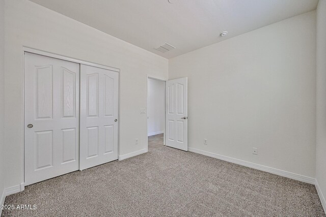 9072 W Myrtle Ave, Glendale, AZ 85305 - unfurnished bedroom featuring carpet flooring, baseboards, and a closet
