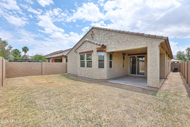 9072 W Myrtle Ave, Glendale, AZ 85305 - rear view of property with a patio area, stucco siding, a tiled roof, and central AC unit