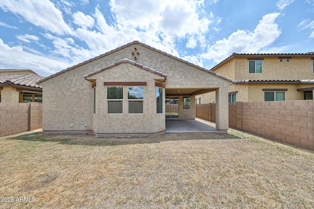 9072 W Myrtle Ave, Glendale, AZ 85305 - rear view of property with a fenced backyard, stucco siding, and a patio