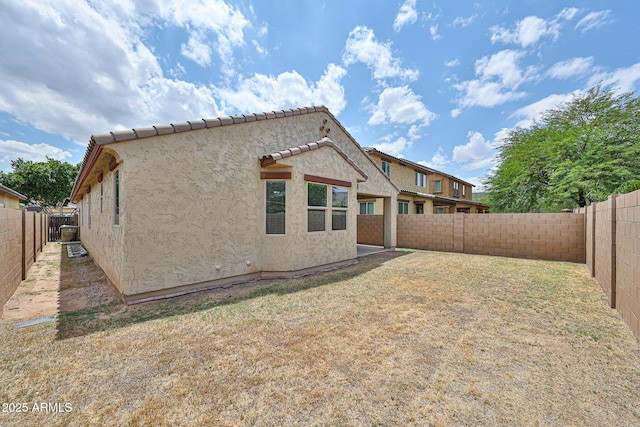 9072 W Myrtle Ave, Glendale, AZ 85305 - rear view of property featuring stucco siding, a fenced backyard, and a tiled roof