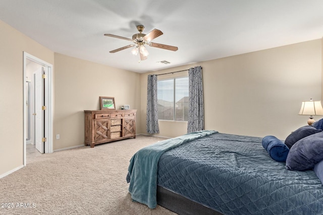 bedroom with carpet floors, visible vents, ceiling fan, and baseboards