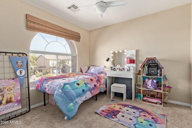 carpeted bedroom featuring baseboards, visible vents, and ceiling fan