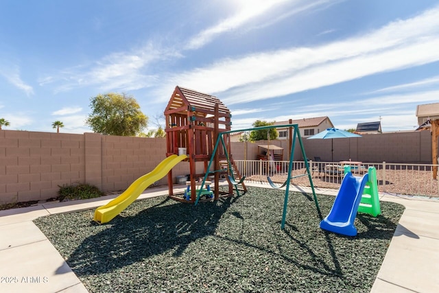 view of jungle gym with fence private yard