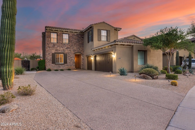 view of front of property with a garage