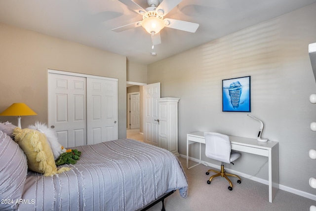 carpeted bedroom featuring a closet and ceiling fan