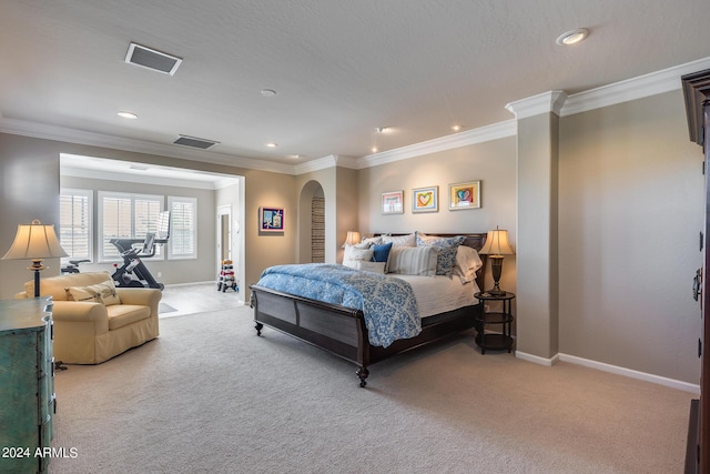 carpeted bedroom featuring crown molding