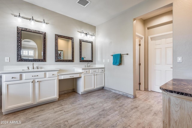 bathroom featuring hardwood / wood-style floors and vanity