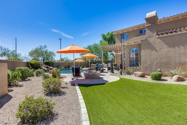 view of yard with a patio and a fenced in pool