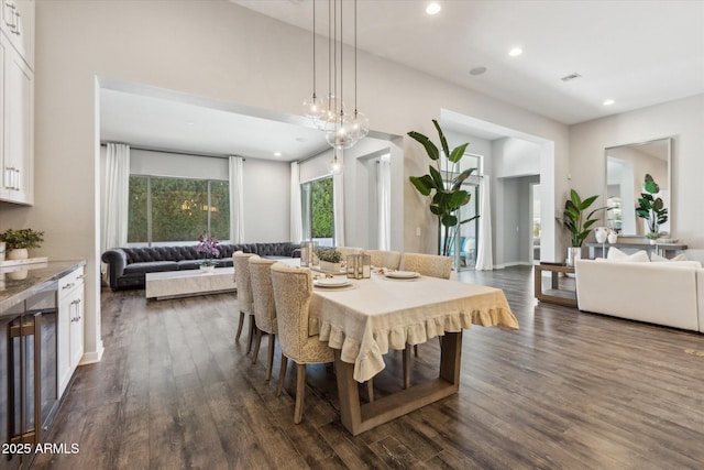 dining room featuring dark wood-type flooring, recessed lighting, and visible vents