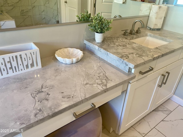 interior space featuring marble finish floor and vanity