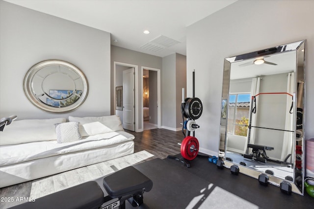 workout room featuring baseboards, wood finished floors, a ceiling fan, and recessed lighting