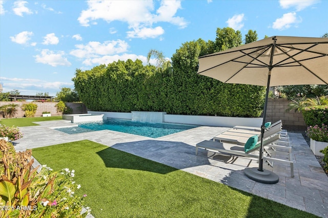 view of swimming pool featuring a yard, a fenced backyard, a fenced in pool, and a patio