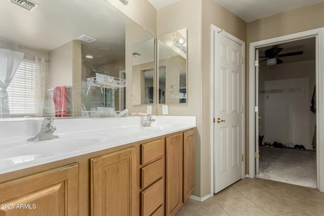 41811 W Avella Dr, Maricopa, AZ 85138 - bathroom featuring a sink, visible vents, a walk in shower, and tile patterned flooring
