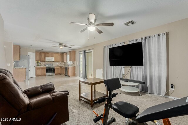 41811 W Avella Dr, Maricopa, AZ 85138 - living room featuring a ceiling fan, baseboards, and visible vents