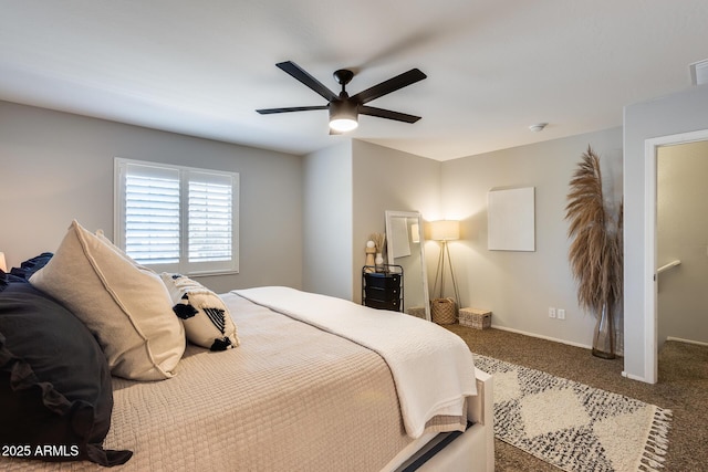 bedroom with dark colored carpet and ceiling fan