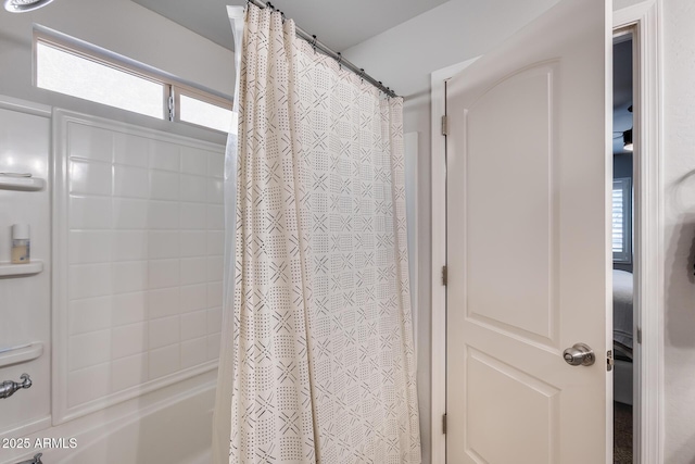 bathroom featuring shower / tub combo with curtain