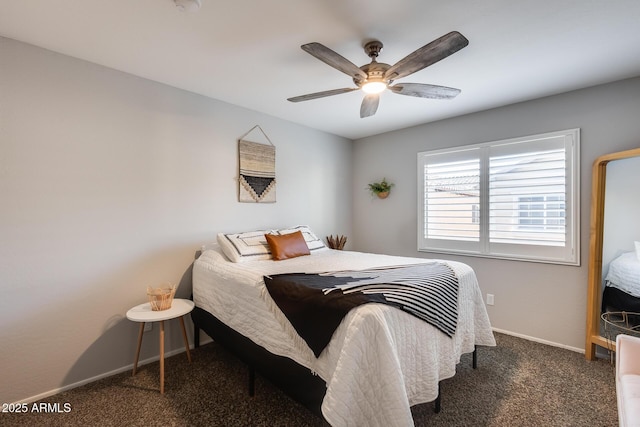 bedroom featuring ceiling fan and dark colored carpet