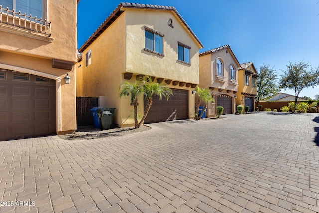 view of side of property with a garage