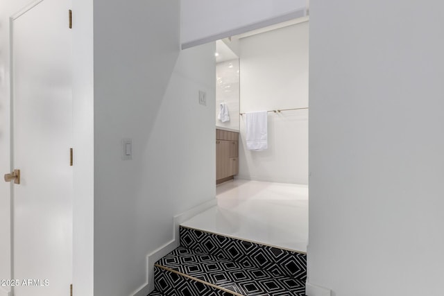 bathroom with baseboards and vanity
