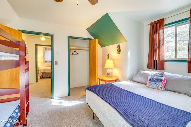 carpeted bedroom with a closet and a ceiling fan