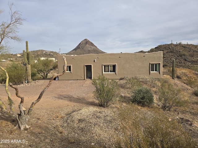 back of property with stucco siding