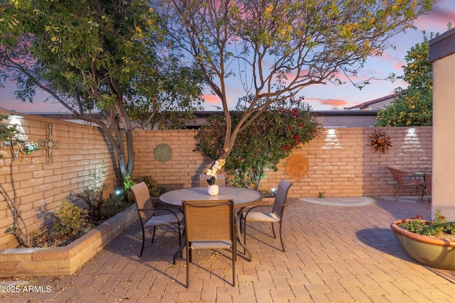 view of patio / terrace with outdoor dining space and a fenced backyard