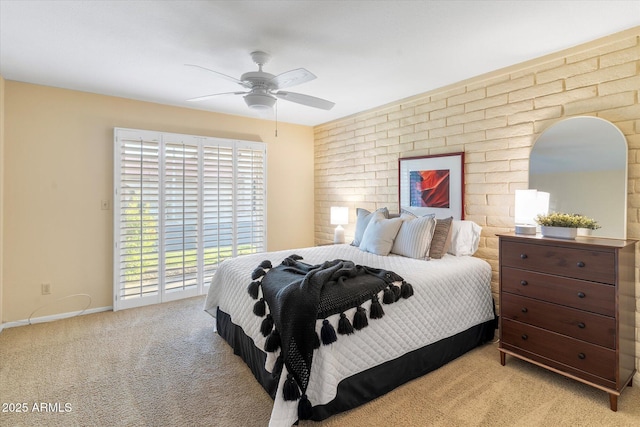 bedroom featuring light colored carpet, ceiling fan, and baseboards