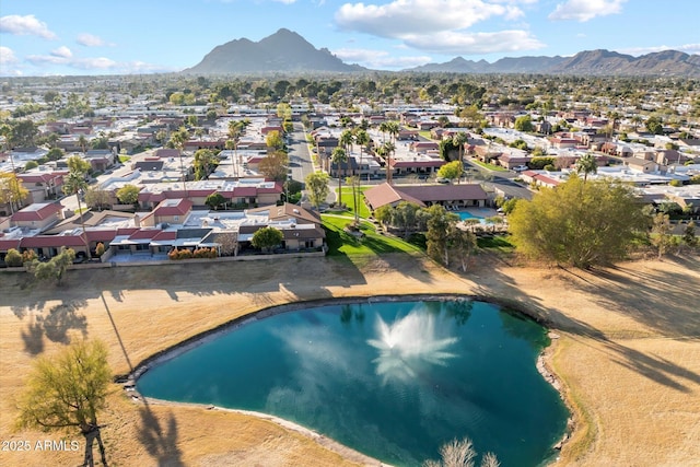 drone / aerial view with a residential view and a water and mountain view