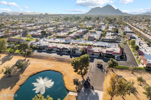 birds eye view of property with a residential view and a water and mountain view