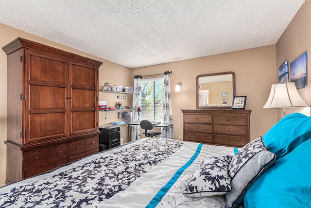 bedroom featuring a textured ceiling