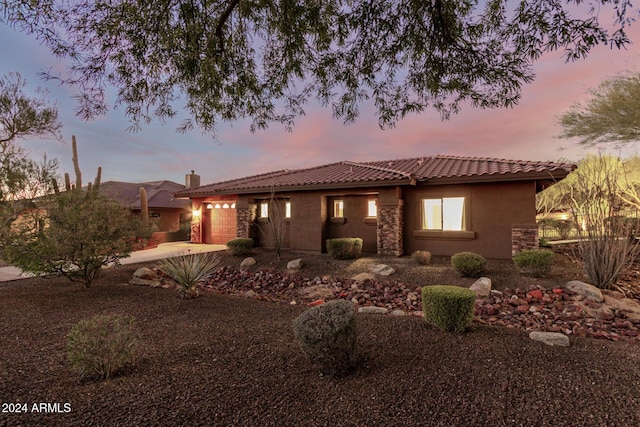 view of front of property with a garage