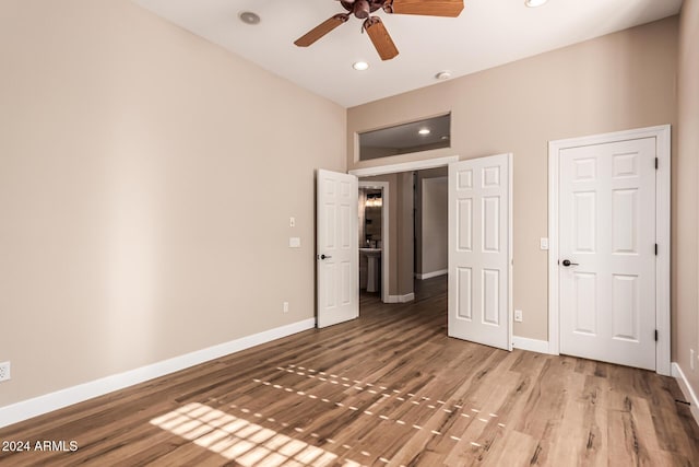 unfurnished bedroom featuring ceiling fan and hardwood / wood-style floors