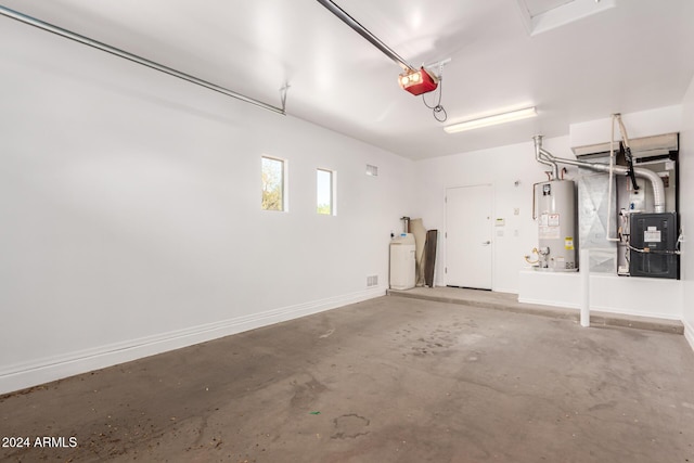 garage with heating unit, a garage door opener, and water heater