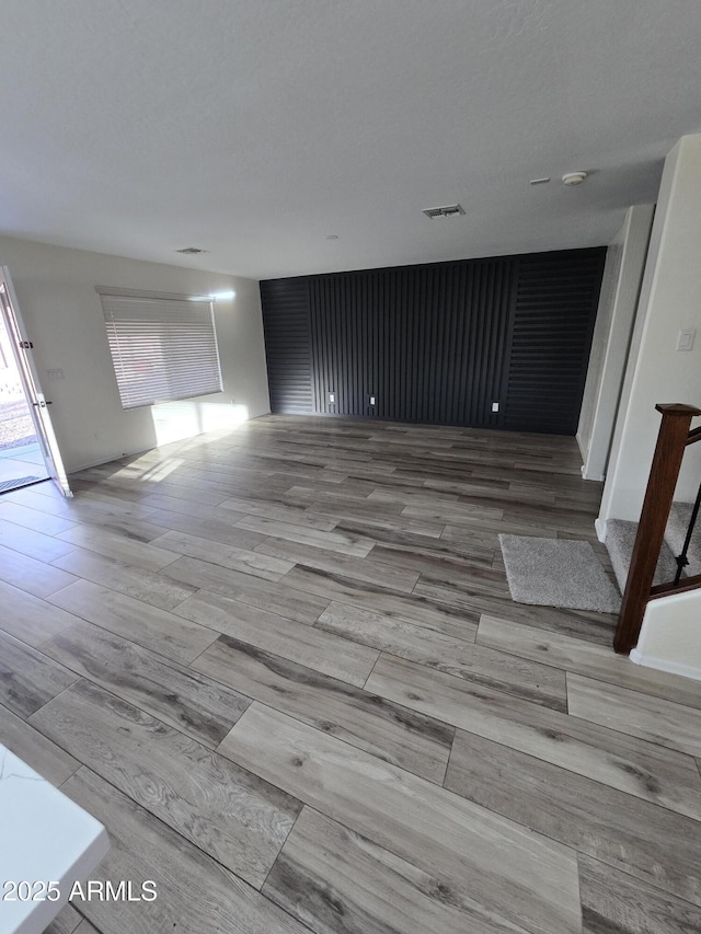 interior space featuring visible vents and wood finished floors