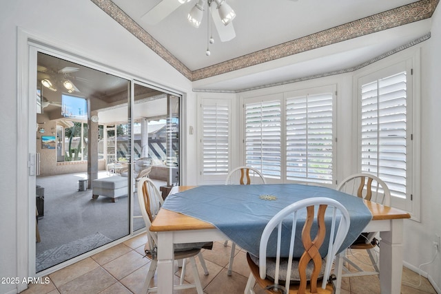 dining room featuring lofted ceiling, plenty of natural light, and ceiling fan