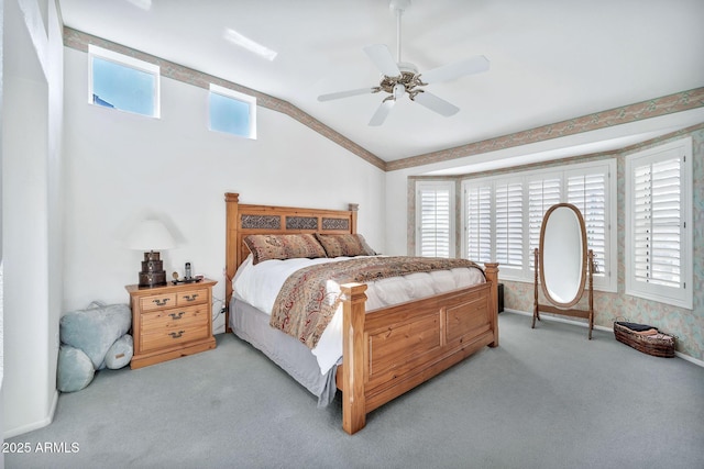 carpeted bedroom featuring ceiling fan and lofted ceiling