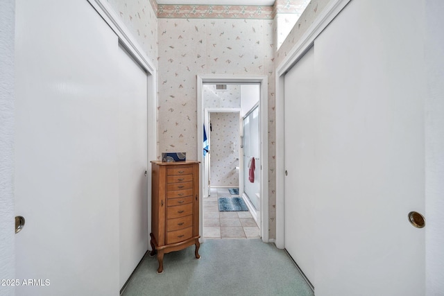 corridor with light colored carpet