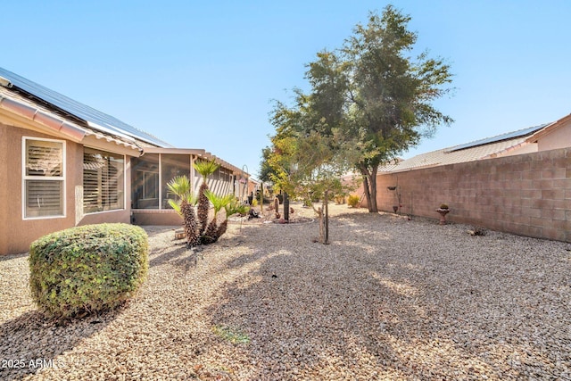 view of yard featuring a sunroom