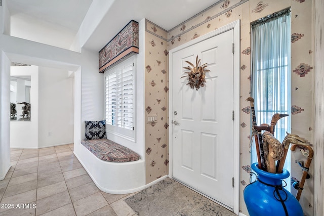 foyer entrance featuring light tile patterned floors