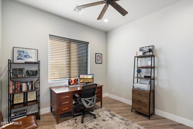 office space with ceiling fan and light hardwood / wood-style flooring