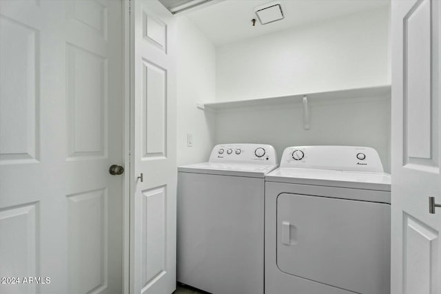 washroom with separate washer and dryer