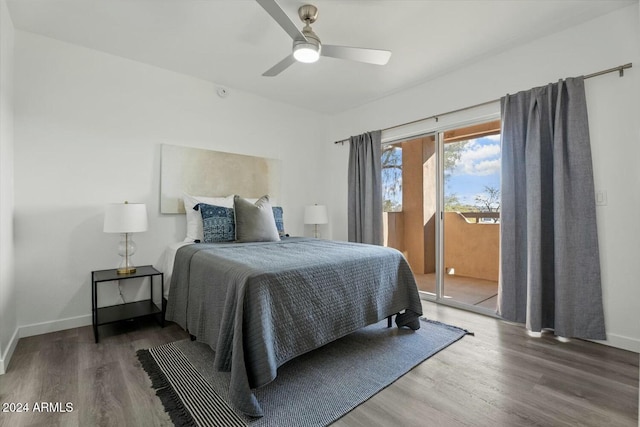 bedroom featuring access to outside, ceiling fan, and dark hardwood / wood-style floors