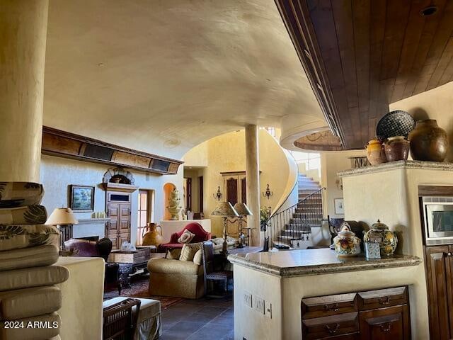 interior space with wooden ceiling and stainless steel microwave