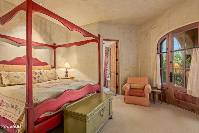 carpeted bedroom featuring french doors