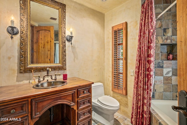 full bathroom featuring shower / tub combo with curtain, tile floors, toilet, and vanity