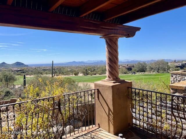 balcony featuring a rural view and a mountain view