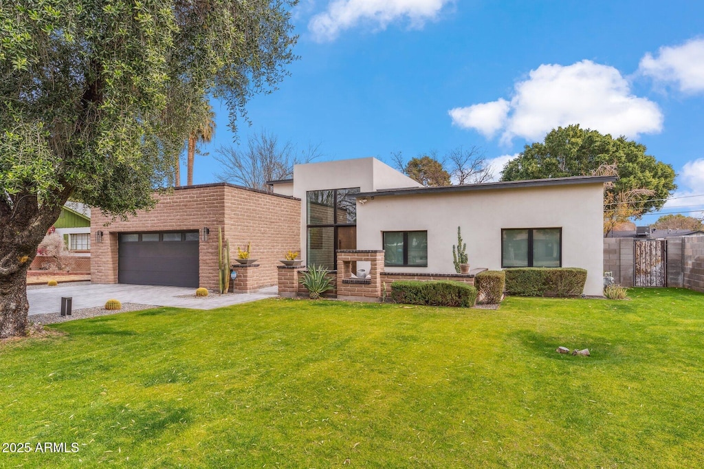 modern home featuring a garage and a front yard